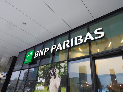 BNP Paribas green and white bank logo on a modern glass building exterior