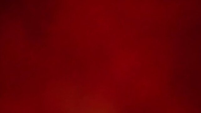 Deep red abstract background in loopable slow motion, subtle blurred smoky texture, elegant moody atmosphere, ample copy space