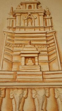 Stunning stupa sculpture, possibly carved from sandstone, at Paravi Duwa Raja Maha Viharaya, a Buddhist temple on a small island off the coast of Matara in southern Sri Lanka