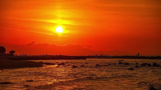Vibrant sunset in Chersonisos, Greece with serene sea and sky