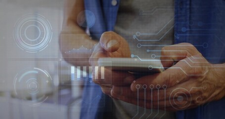 Tapping pair of hands wearing blue shirt interacting with smartphone at home office, AR overlays