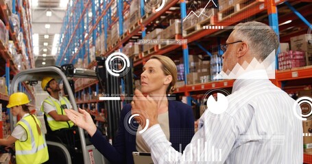 Gesturing operations manager in blazer discussing workflow in depot aisle with tablet and forklift © vectorfusionart