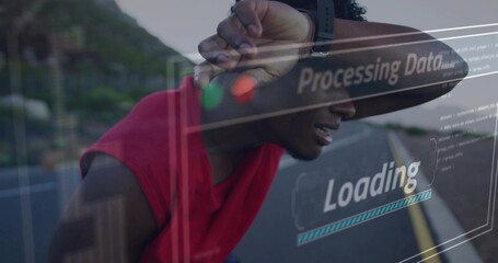 Leaning man in red tank top, dark cap shielding eyes by guardrail, showing Loading Processing Data