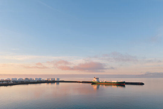 Ship docked at nor&eth;urbugt port with storage tanks, reykjavik