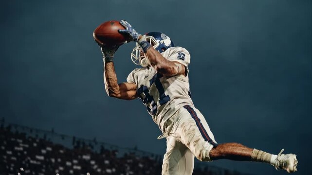 Professional American football receiver stretching for a long pass with dramatic lighting, showcasing peak performance, explosive athletic motion, competitive gameplay, winning mindset