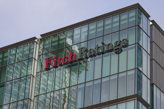 Fitch Ratings logo at the top of a skyscraper, Canary Wharf., London, UK.