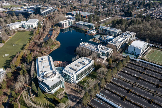 Beaverton, Oregon, USA - Jan 24, 2026 - Aerial drone photo of Nike World Headquarters campus showing multiple Nike office buildings, corporate facilities, parking areas, internal roads, and greenery 