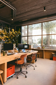 Interior of empty modern design office with computers on desk