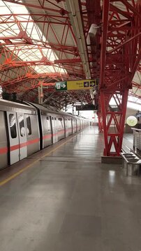 New Delhi, India, April 16 2025 - Delhi Metro train arriving at Jhandewalan metro station in New Delhi, India, Asia, Public Metro departing from Jhandewalan station