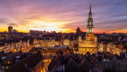 Fototapeta premium 5 march 2025, Poznan, Poland. Aerial, drone view during sunset, twilight, on the old market square, Stare Rynek town in the city centre of Poznan, Poland. Warm golden light. Wonderful must-see tourist