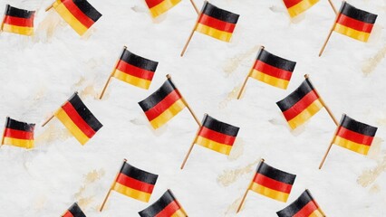 Pattern of German flags on light textured background