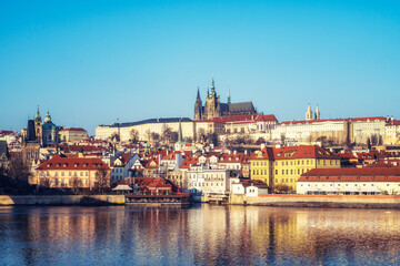 Fototapeta premium Cityscape of Prague with Vltava River, beautiful buildings of Mala Strana and Hradcany Castle in morning light, Czech Republic