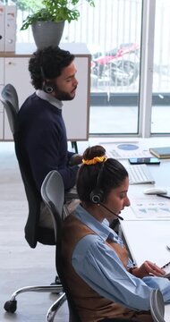 Call center, above or people with headset, lead generation or consulting in financial advisory. Telemarketing, coworking or agents with tech, outbound contact or investment management in help desk.