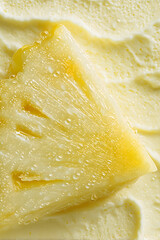 Macro close-up of pineapple ice cream slice with glossy texture and fresh droplets