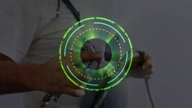 Animation hud processing over caucasian repairman wearing mask while spray painting automotive part