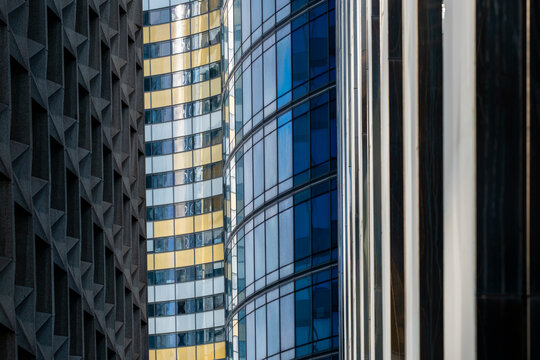 Modern urban office architecture detail showing glass facade pattern in Paris La Defense with clean lines texture and abstract geometry