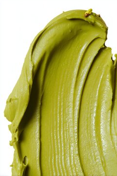 Crema untada de pistacho verde con trozos peque&ntilde;os, Textura cremosa de pistacho elegante para postre gourmet, Fondo vibrante de crema de pistacho para publicidad de alimentos