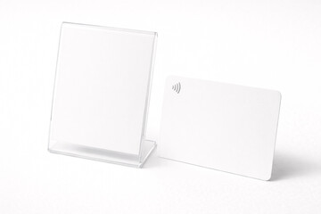 Blank transparent acrylic sign holder with white insert isolated on white background. Desk display mockup for branding or information.