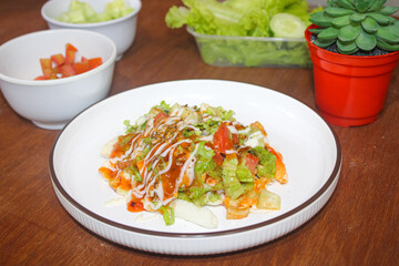 Delicious Crispy Loaded Fries with Fresh Salad Topping and Creamy Sauces