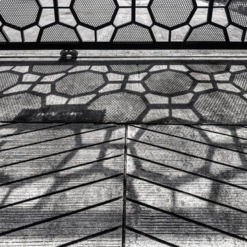 Black and White High Contrast Shadow of Perforated Metal Fence