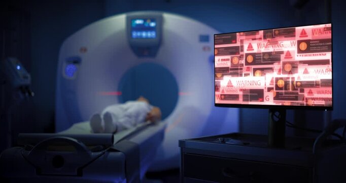 In a Hospital Mri Room, a White Female Patient Lies in the Scanner While a Nearby Computer Shows Virus and Malware Warnings. Ransomware and a Cyber Security Attack Disrupting Medical Facility Work