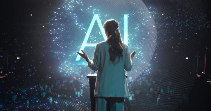 Female University Professor Speaking at a Podium, Teaching Computer Science With a AI Hologram to Packed Auditorium. Digital Data Particles Visualisation Explains Software, Programming Students.