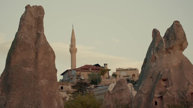 Camel walking through a desert landscape under natural light. Iconic animal adapted to extreme conditions, symbolizing endurance, survival, travel, and traditional desert life. Ideal for travel, touri