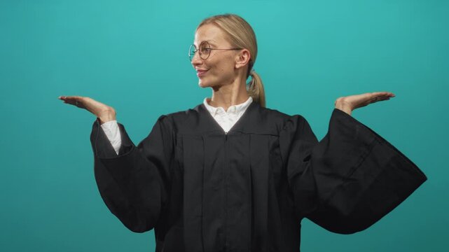 Woman judge middle age blonde wearing glasses in black robe holds palms up with hands open in studio; decision balance confident.