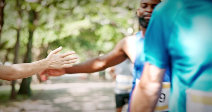 Running, marathon and people with spectators outdoor for race, endurance challenge and support. Sports event, workout and athlete with high five in park for runners contest, competition and exercise