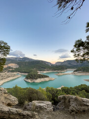 Naklejka premium Landscape View of Guadalhorce Dam Affected by Water Shortage at Sunset, Andalusia, Spain