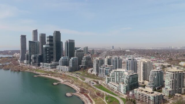 Pullback Aerial Shot Of Parklawn Neighbourhood Skyline On Lake Ontario In Toronto, Canada.
