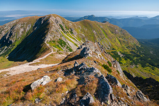 View of sun-kissed peaks, rocky ridges, and verdant slopes paint a stunning panorama across the Western Tatras in Brestova, Zilina Region, Slovakia.