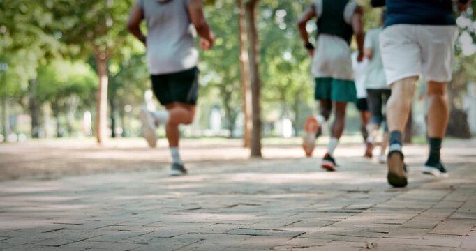 People, legs or running club in park with fitness, sports challenge or endurance training for wellness. Group, feet or shoes outdoor with cardio workout, speed exercise or Paris marathon preparation.
