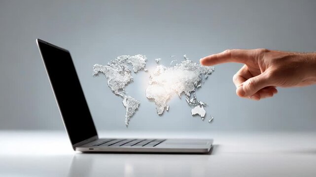 Professional businessman pointing holographic world map emerging from laptop screen, representing global connectivity, remote working trends, digital business landscape