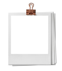 Obraz na płótnie Canvas Vintage Polaroid, instant photo frame isolated in transparent PNG, polaroid frame - isolated design element, polaroids with metal gold binder clip.
