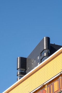 architecture urban residential modern rooftop with chimney vents in liljeholmskajen district stockholm sweden under open sky daylight