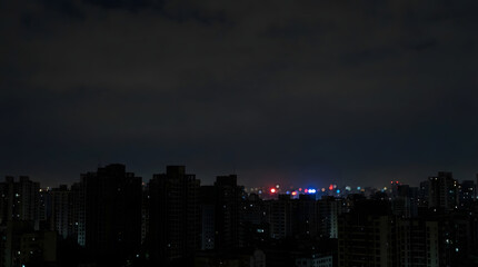 Fototapeta premium City power outage concept with dark skyline