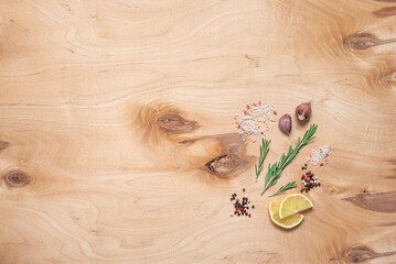 Cooking ingredients on wooden background, top view, flat lay, spices, herbs.
