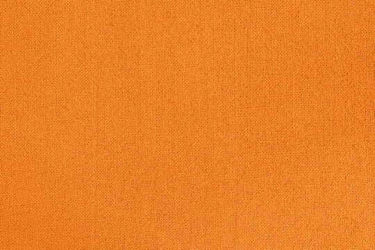 Orange fabric cloth texture for background, natural textile pattern.