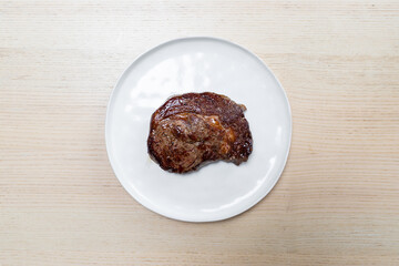 Freshly grilled beef steak on a plate.