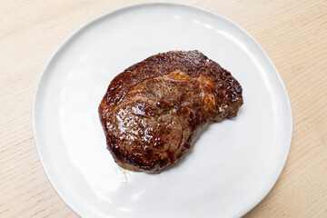 Freshly grilled beef steak on a plate.