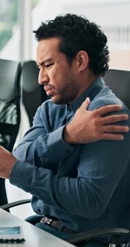 Posture, shoulder pain and sore with business man in office for symptoms of arthritis or cramp. Massage, stiff joint and typing with employee person in workplace for fibromyalgia or osteoporosis