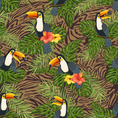 Obraz premium Birds in leaves on a spotted background.Vector pattern with palm leaves and toucans on a tiger background.