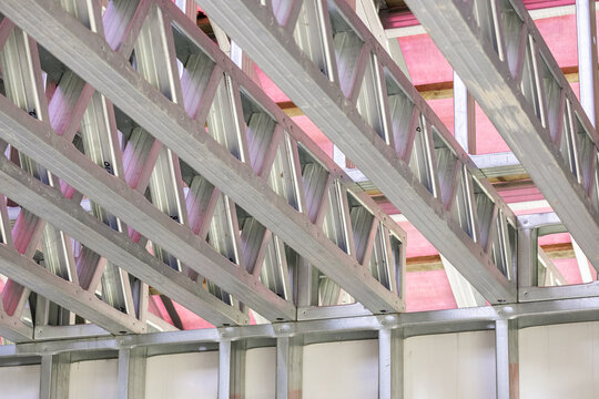 Metal stud framing system with rust resistant coating in a drywall assembly. Metal house frame. Construction of a private frame house. Steel wall frames. Construction background, house construction.