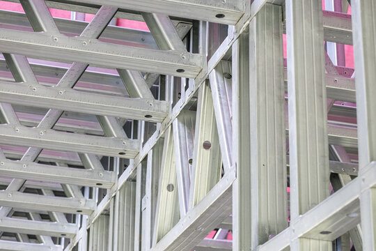 Metal stud framing system with rust resistant coating in a drywall assembly. Metal house frame. Construction of a private frame house. Steel wall frames. Construction background, house construction.