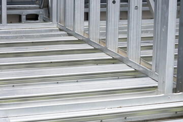 Obraz premium Metal stud framing system with rust resistant coating in a drywall assembly. Metal house frame. Construction of a private frame house. Steel wall frames. Construction background, house construction.