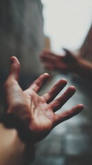 Hands reaching out to connect with another person