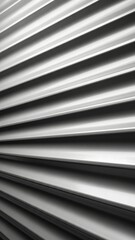 Fototapeta premium Textured lines dance together in graceful symmetry as gentle light casts shadows across a vertical surface, creating an artistic interplay of form and illumination