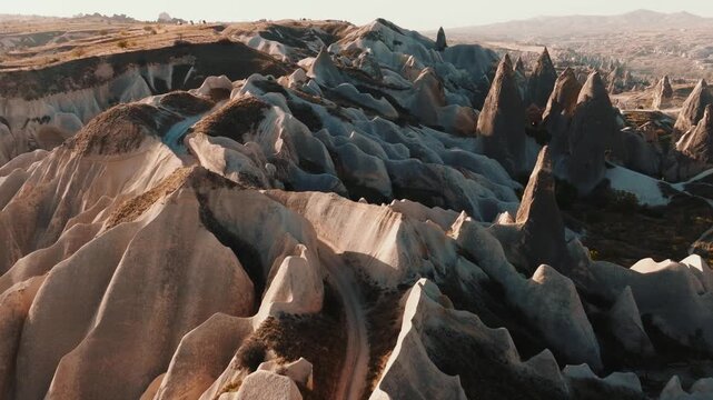 Scenic view of Love Valley in Cappadocia, Turkey, famous for its unique rock formations and fairy chimneys shaped by volcanic activity and erosion.