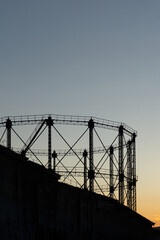 Industrial Gasometer Silhouette at Technopolis Gazi Athens Greece at Sunset with Street Art Graffiti and Historic Architecture